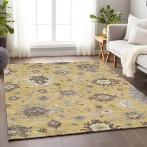 Photo of Gold Gray And Ivory Floral Medallion Washable Area Rug With UV Protection
