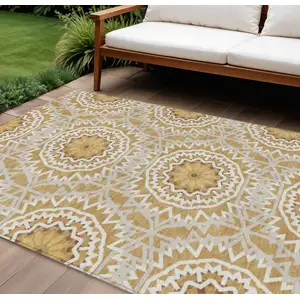 Photo of Gold Gray And Ivory Floral Medallion Washable Indoor Outdoor Area Rug