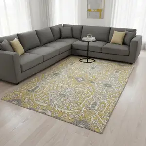 Photo of Gold Gray And Ivory Floral Washable Area Rug With UV Protection