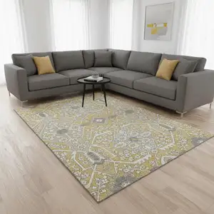 Photo of Gold Gray And Ivory Floral Washable Area Rug With UV Protection