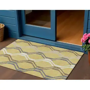Photo of Gold Gray And Ivory Geometric Washable Indoor Outdoor Area Rug