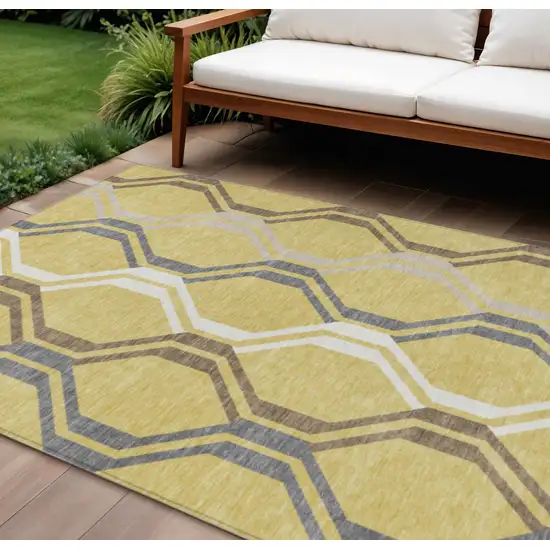 Gold Gray And Ivory Geometric Washable Indoor Outdoor Area Rug Photo 1
