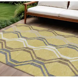 Photo of Gold Gray And Ivory Geometric Washable Indoor Outdoor Area Rug