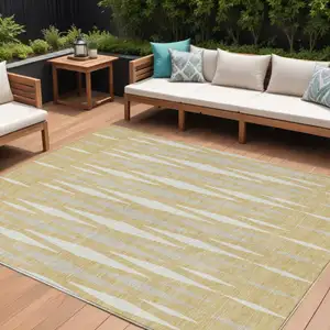 Photo of Gold Gray And Ivory Geometric Washable Indoor Outdoor Area Rug