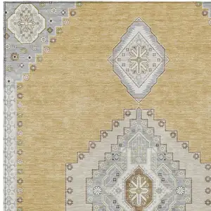 Photo of Gold Gray And Ivory Oriental Washable Indoor Outdoor Area Rug