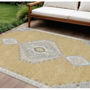 Photo of Gold Gray And Ivory Oriental Washable Indoor Outdoor Area Rug