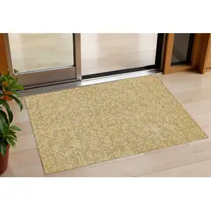 Photo of Gold Gray And Ivory Polka Dot Washable Indoor Outdoor Area Rug