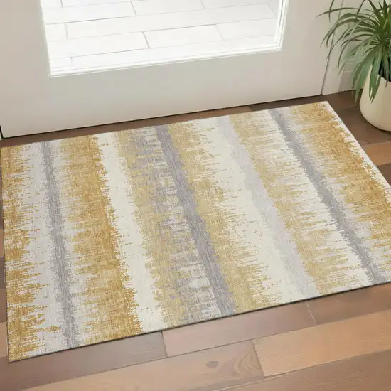 Gold Gray And Ivory Striped Washable Area Rug With UV Protection Photo 1