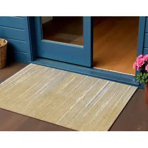 Photo of Gold Gray And Ivory Striped Washable Indoor Outdoor Area Rug