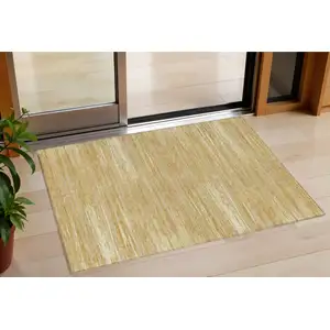 Photo of Gold Gray And Ivory Striped Washable Indoor Outdoor Area Rug