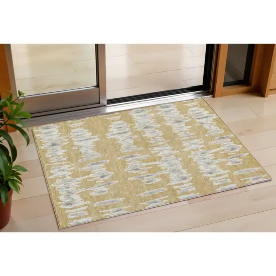 Gold Gray And Ivory Striped Washable Indoor Outdoor Area Rug Photo 1