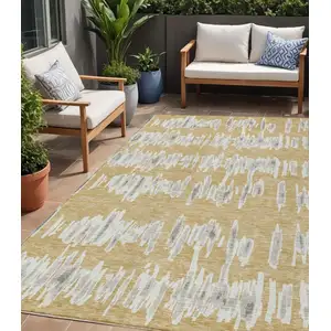 Photo of Gold Gray And Ivory Striped Washable Indoor Outdoor Area Rug