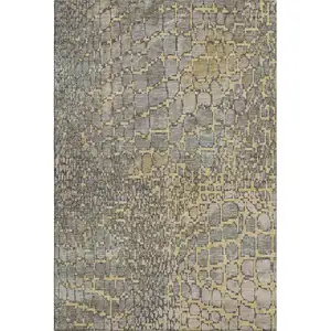 Photo of Gold Gray And Silver Abstract Geometric Washable Area Rug With UV Protection