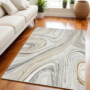 Photo of Gold Gray and Ivory Abstract Non Skid Area Rug