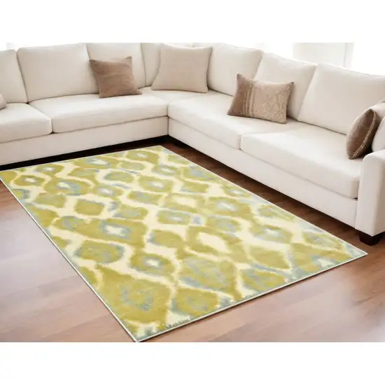 Gold Gray and Tan Abstract Power Loom Area Rug Photo 1