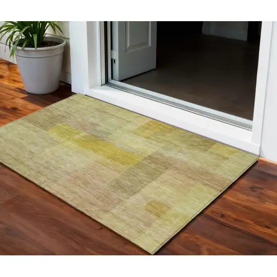 Gold Green And Brown Abstract Washable Indoor Outdoor Area Rug Photo 1