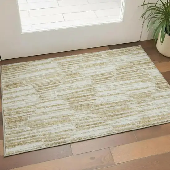 Gold Ivory And Beige Abstract Washable Area Rug With UV Protection Photo 1