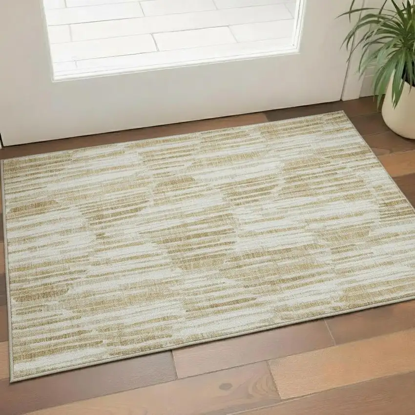 Gold Ivory And Beige Abstract Washable Area Rug With UV Protection Photo 1
