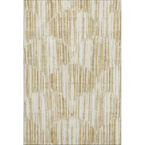 Photo of Gold Ivory And Beige Abstract Washable Area Rug With UV Protection