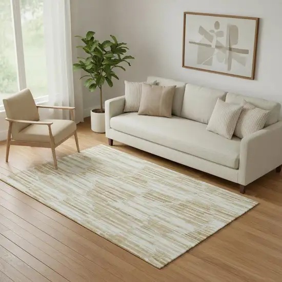 Gold Ivory And Beige Abstract Washable Area Rug With UV Protection Photo 1