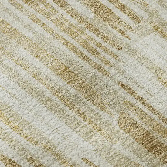 Gold Ivory And Beige Abstract Washable Area Rug With UV Protection Photo 9