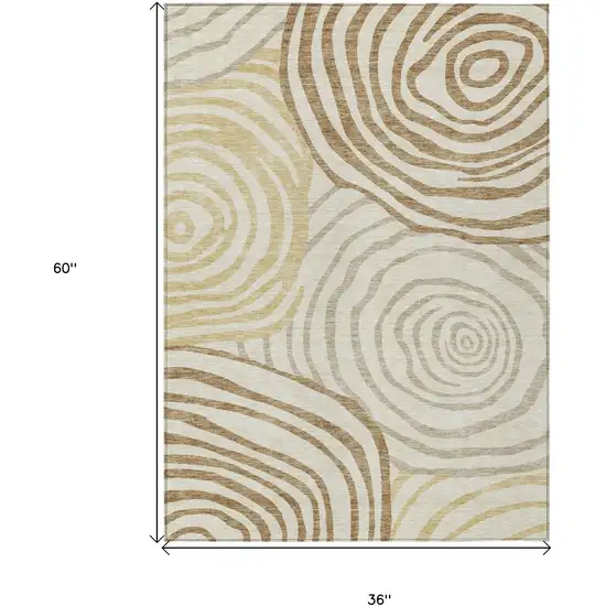 Gold Ivory And Beige Abstract Washable Indoor Outdoor Area Rug Photo 7