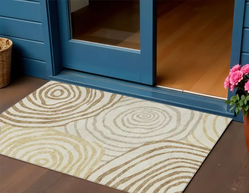 Gold Ivory And Beige Abstract Washable Indoor Outdoor Area Rug Photo 1