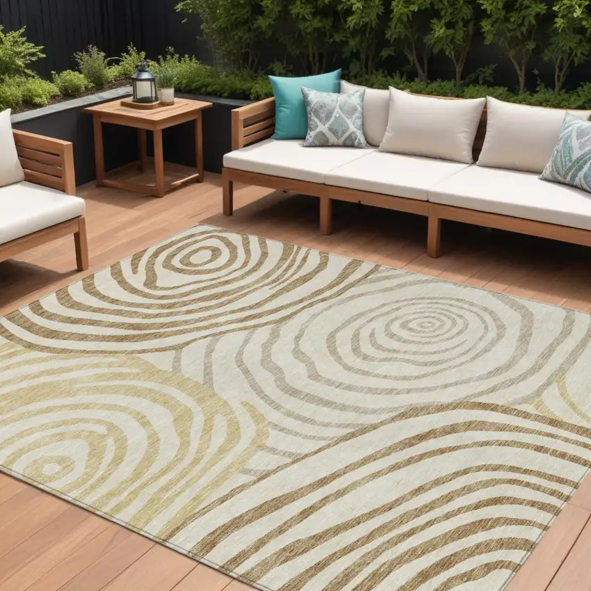 Gold Ivory And Beige Abstract Washable Indoor Outdoor Area Rug Photo 1