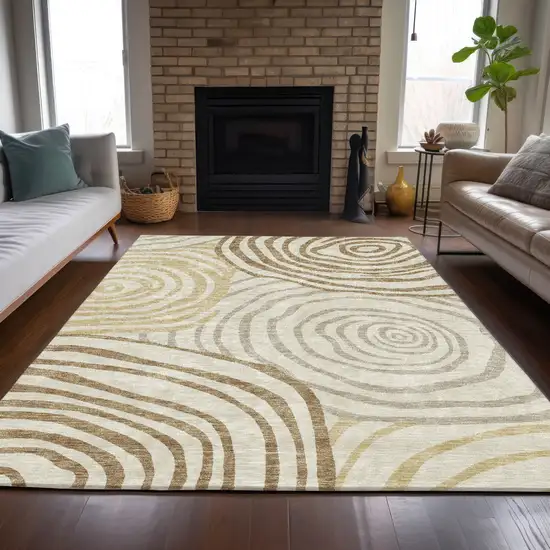 Gold Ivory And Beige Abstract Washable Indoor Outdoor Area Rug Photo 7