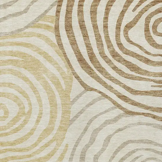 Gold Ivory And Beige Abstract Washable Indoor Outdoor Area Rug Photo 4