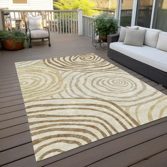 Gold Ivory And Beige Abstract Washable Indoor Outdoor Area Rug Photo 9