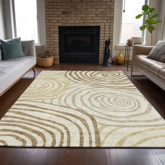 Gold Ivory And Beige Abstract Washable Indoor Outdoor Area Rug Photo 7
