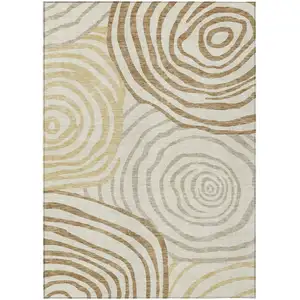 Photo of Gold Ivory And Beige Abstract Washable Indoor Outdoor Area Rug