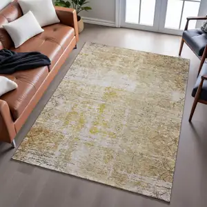 Photo of Gold Ivory And Beige Geometric Washable Area Rug With UV Protection