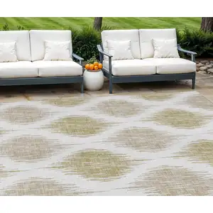 Photo of Gold Ivory And Beige Ikat Washable Indoor Outdoor Area Rug