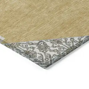 Photo of Gold Ivory And Beige Oriental Washable Indoor Outdoor Area Rug