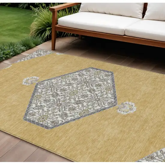 Gold Ivory And Beige Oriental Washable Indoor Outdoor Area Rug Photo 1