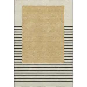 Photo of Gold Ivory And Black Striped Washable Area Rug With UV Protection