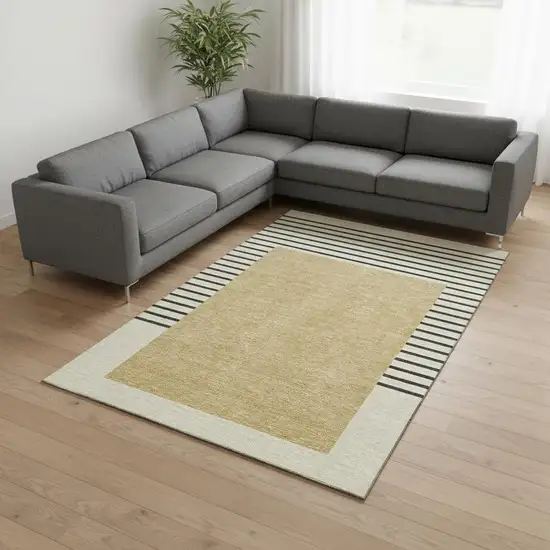 Gold Ivory And Black Striped Washable Area Rug With UV Protection Photo 2