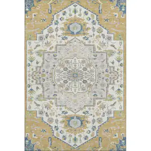 Photo of Gold Ivory And Blue Oriental Washable Area Rug With UV Protection