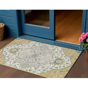 Photo of Gold Ivory And Blue Oriental Washable Indoor Outdoor Area Rug