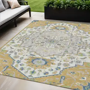 Photo of Gold Ivory And Blue Oriental Washable Indoor Outdoor Area Rug