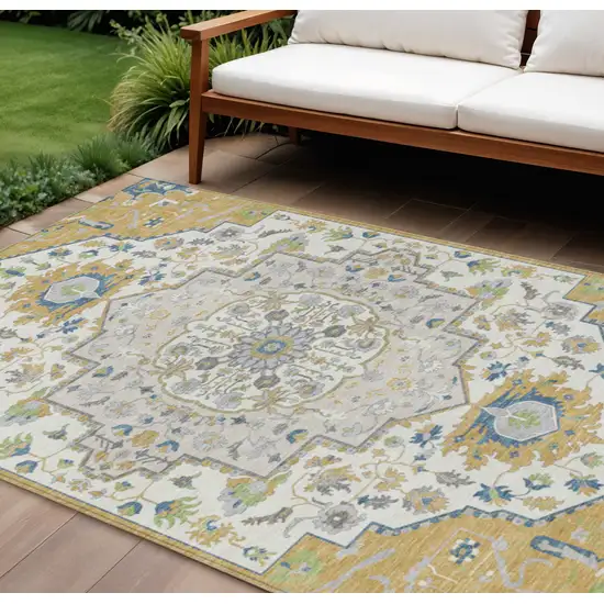 Gold Ivory And Blue Oriental Washable Indoor Outdoor Area Rug Photo 1