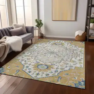 Photo of Gold Ivory And Blue Oriental Washable Indoor Outdoor Area Rug