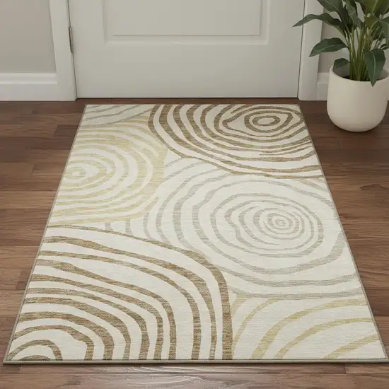 Gold Ivory And Brown Abstract Washable Area Rug With UV Protection Photo 2