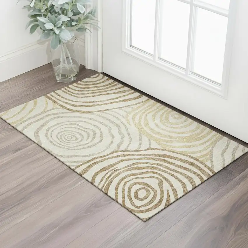 Gold Ivory And Brown Abstract Washable Area Rug With UV Protection Photo 1