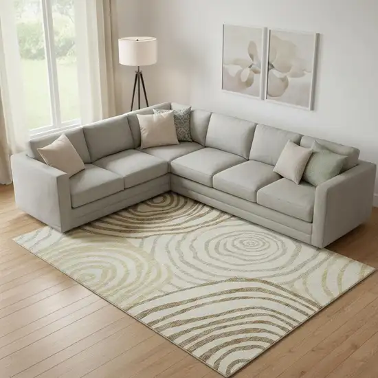 Gold Ivory And Brown Abstract Washable Area Rug With UV Protection Photo 1