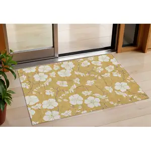 Photo of Gold Ivory And Brown Floral Washable Indoor Outdoor Area Rug