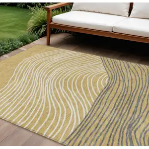 Photo of Gold Ivory And Charcoal Striped Washable Indoor Outdoor Area Rug