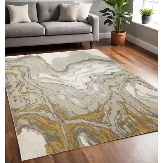 Gold Ivory And Gray Abstract Area Rug Photo 1